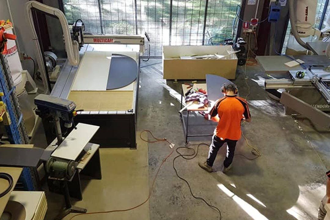 Factory with Spoke Building and Interiors team member manufacturing custom furniture for Central Coast, Newcastle and Hunter commercial fitouts